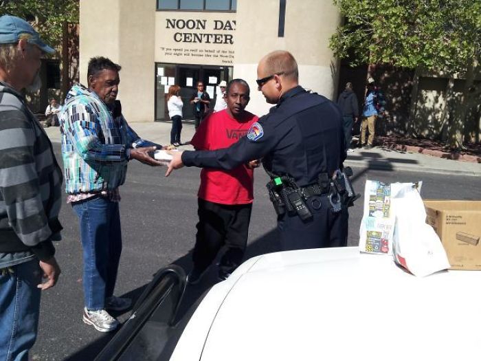 Officer Buying Meals For Homeless People