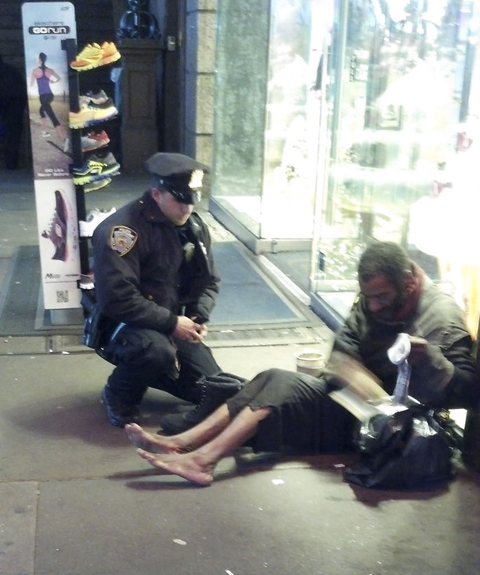 Officer Giving Shoes To A Homeless Man