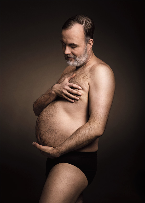 Man Cradling His Beer Belly Like Pregnant Mom