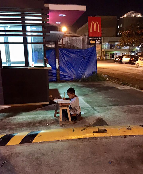 Homeless Boy Does His Homework Using The Light From A Local Mcdonald’s