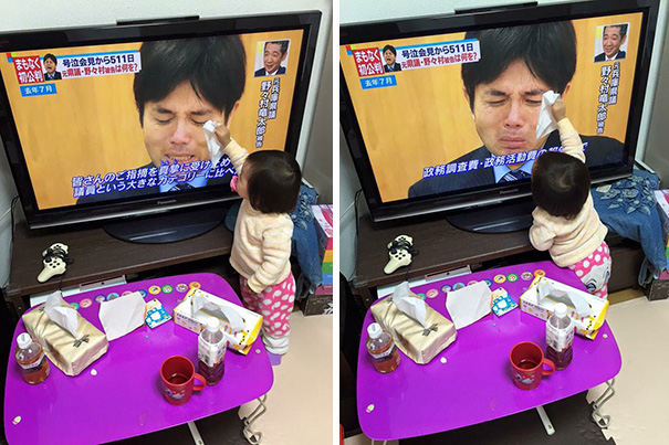 Baby Trying To Dry The Tears Of A Japanese Politician
