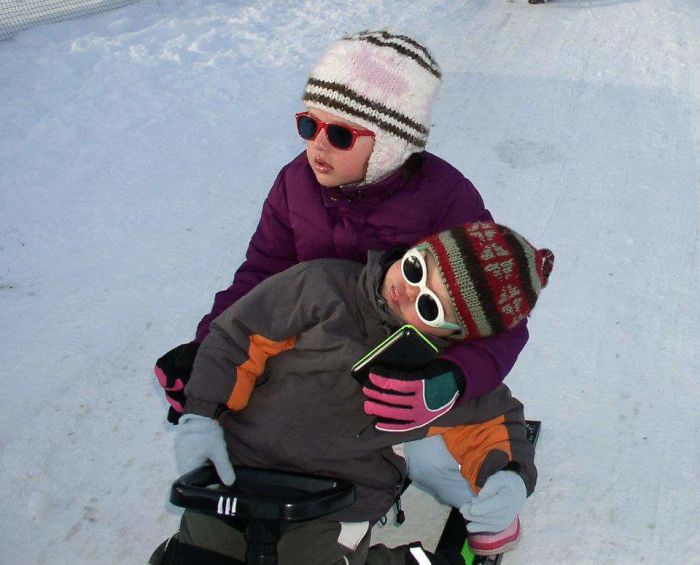Napping On The Sleigh With Older Sister...