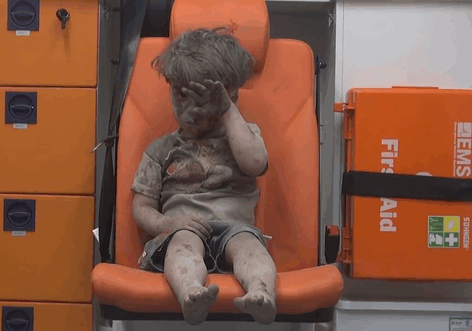 Heartbreaking Photo Of Dazed 5-Year-Old Boy Shows The Horrors Of Syria's Civil War
