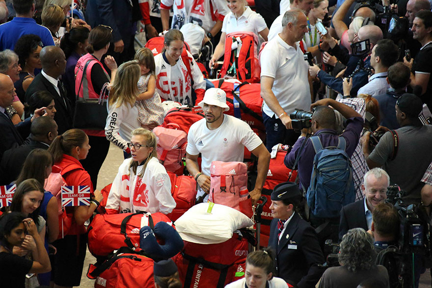 british-olympic-athletes-red-bags-heathrow-airport-8
