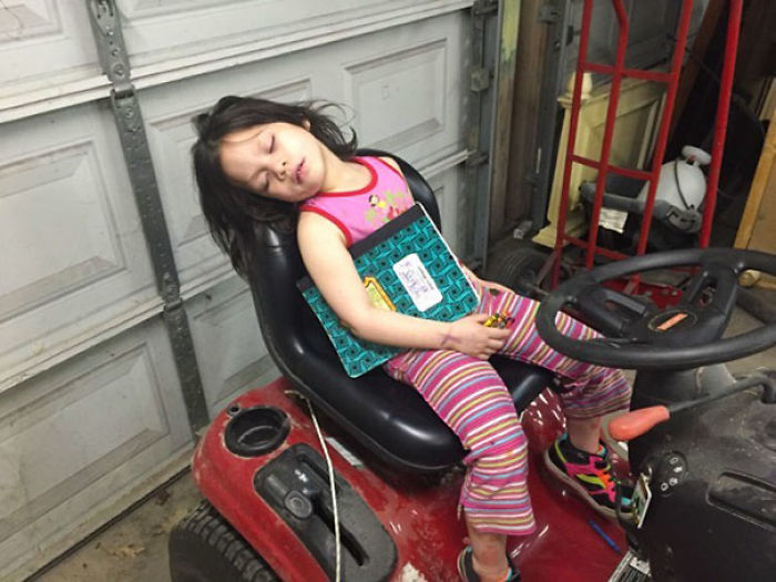 Napping On The Riding Lawn Mover. Amazing That She Can Still Hold On To Her Book And Crayons