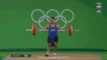 Olympic Weightlifting David Katoatau Celebrating His Lift To The Accompaniment Of A Swing Band