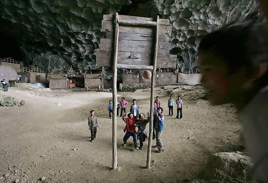 This Giant Cave In China Has 100 People Living Inside, A Basketball Court And Even Had A School