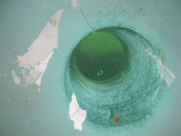 Friend Went Ice Fishing And Decided To Take A Pic Of The Ice Hole. Oops