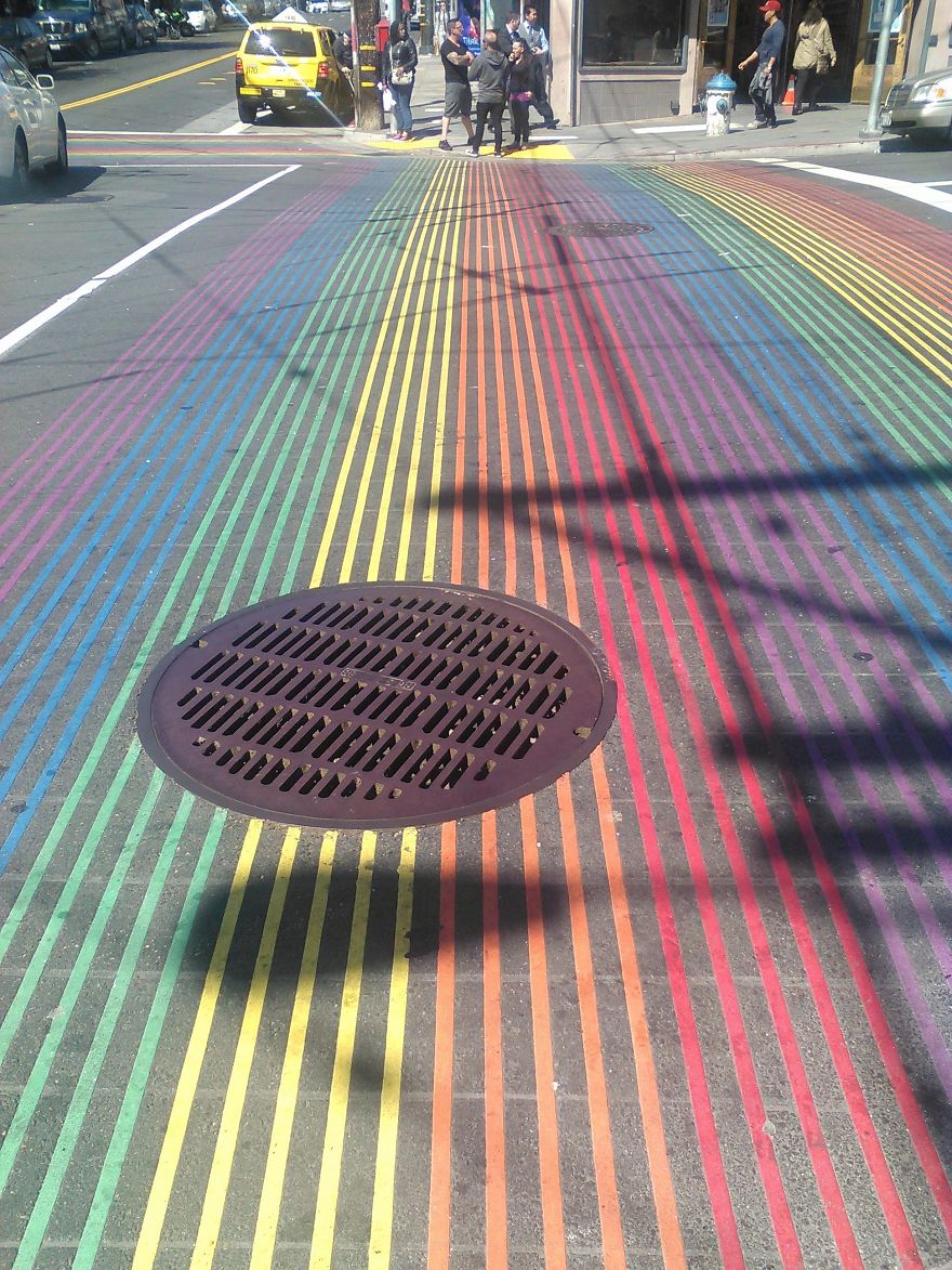 Floating Manhole Cover In The Rainbow Crosswalk Of San Francisco