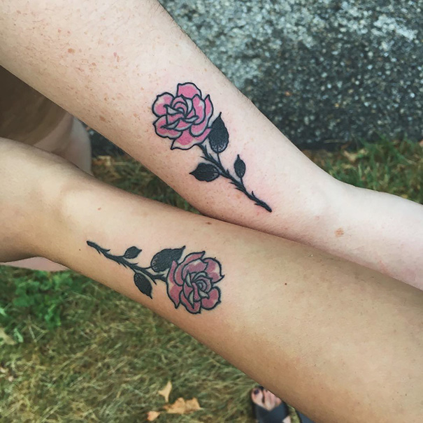 Two colorful rose hand tattoos 