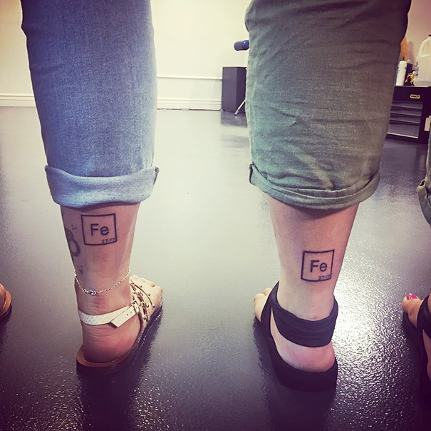 Two chemical symbols feet tattoos 