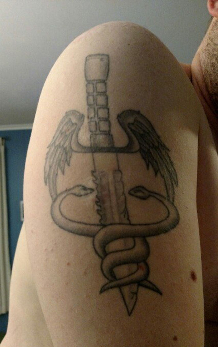 Tattoo Of The Medic Symbol Covering Burn Scars