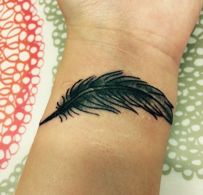 Black Feather Tattoo Covering Scars From Self-Harm