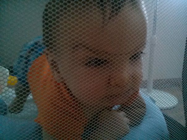 My Son Trying To Escape From The Baby Cage.