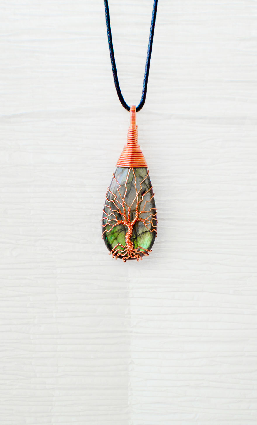 Discarded Copper Wire Twisted Into Trees To Beautifully Frame Dazzling Stone Pendants