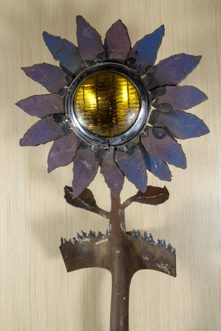 I Also Cut Shovels. The Blue And Lavender Peddles On This Fog Light Flower Is Made From The Scrap Metal Of A Dumpster
