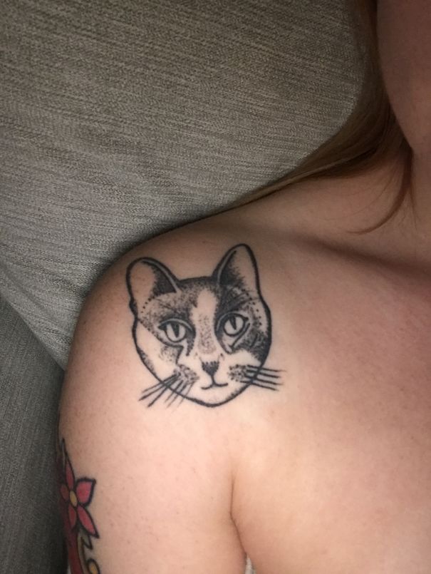 Cat face shoulder tattoo