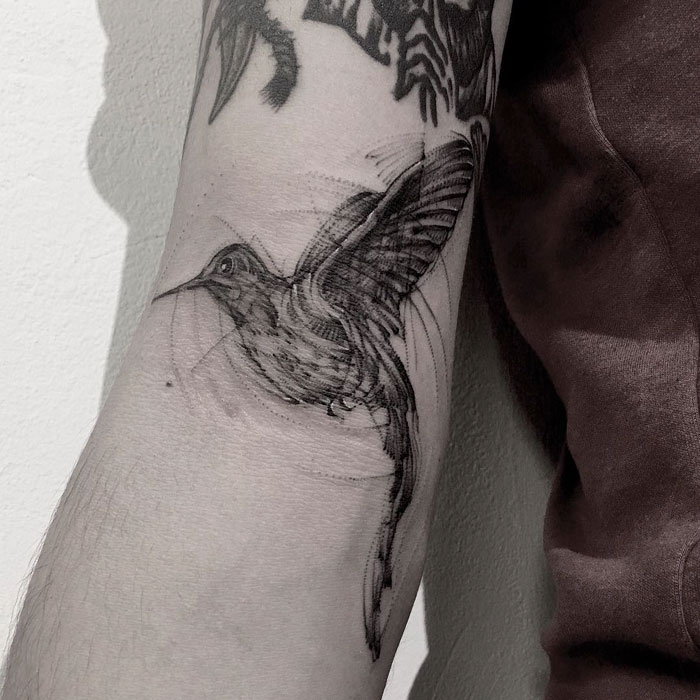 Hand bird tattoo 
