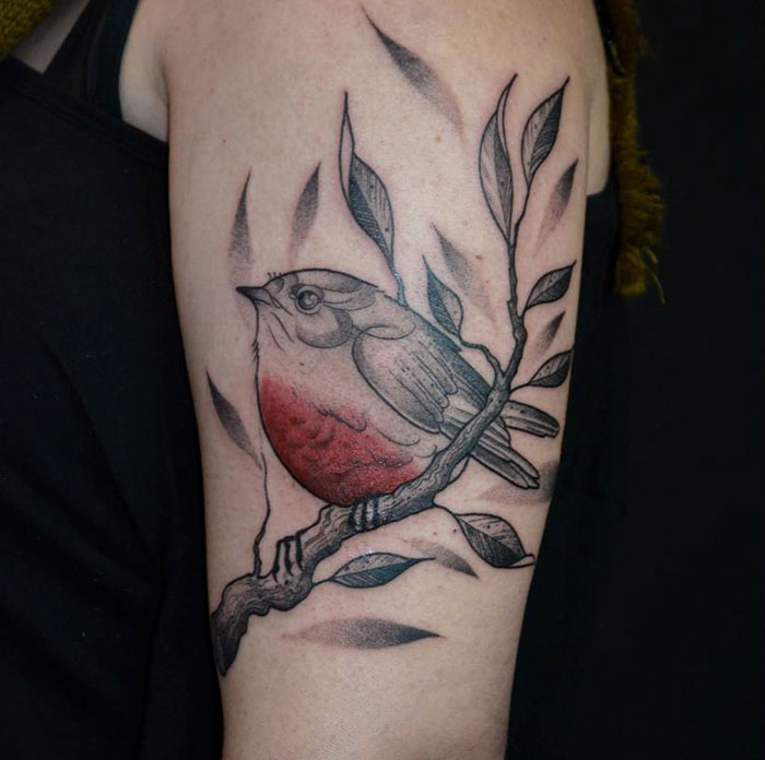 Colorful arm bird tattoo 