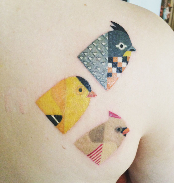 Colorful back bird tattoos