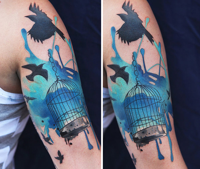 Colorful bird and cage tattoo 