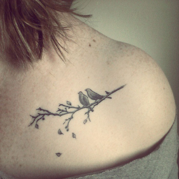 Small collarbone bird tattoo 