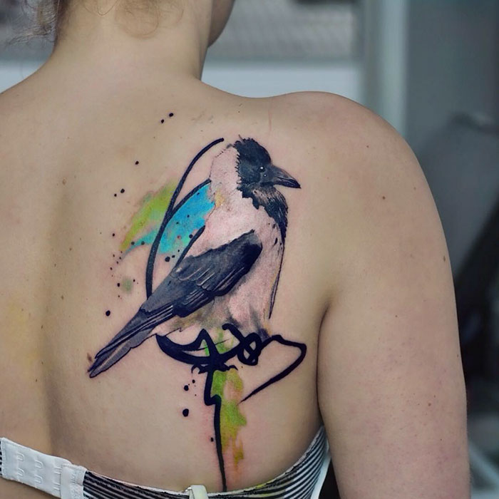 Colorful back bird tattoo 