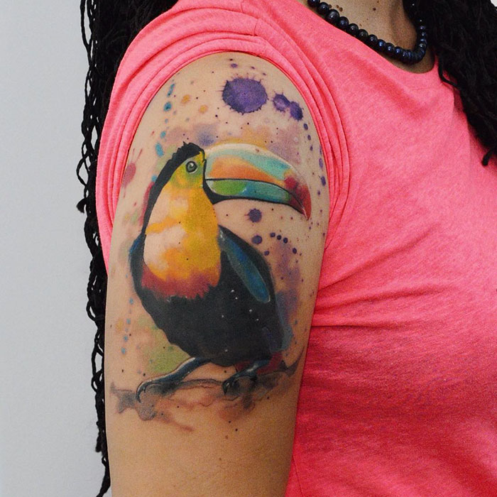 Colorful hand bird tattoo 