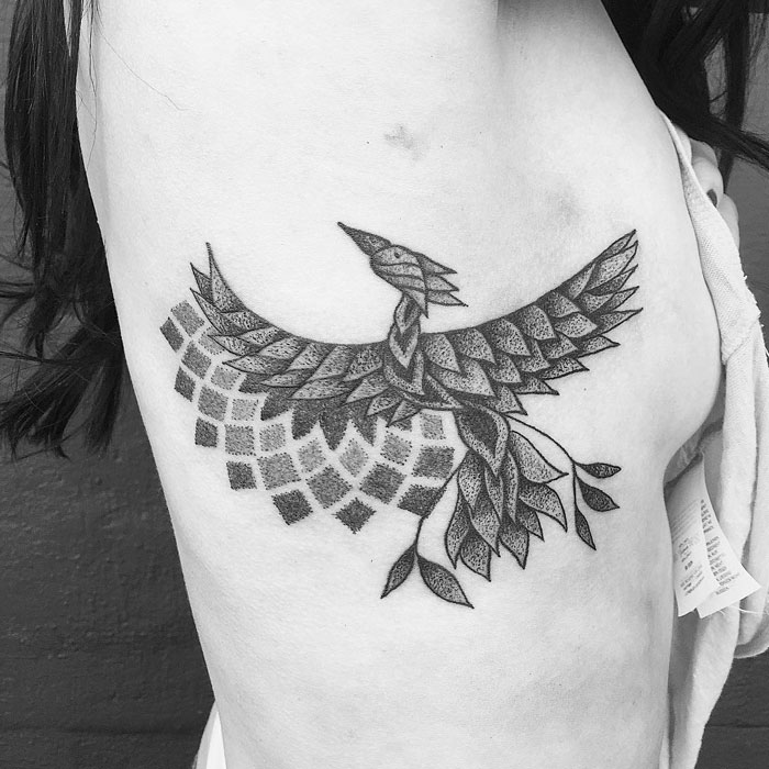 cheekbone bird tattoo