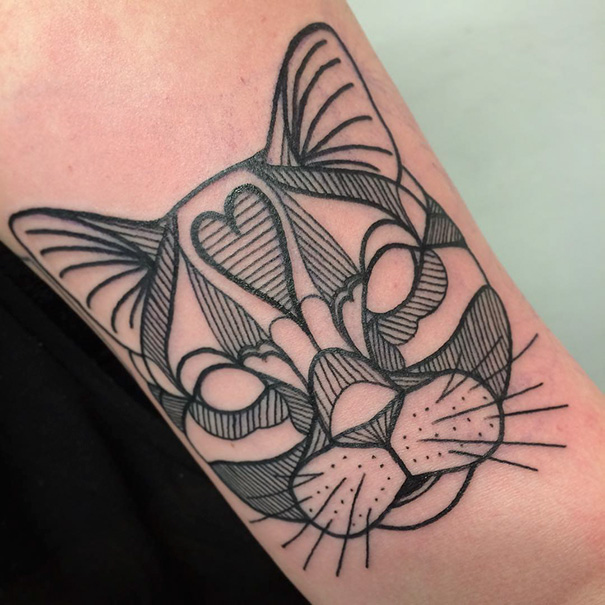 Geometrical line cat face arm tattoo