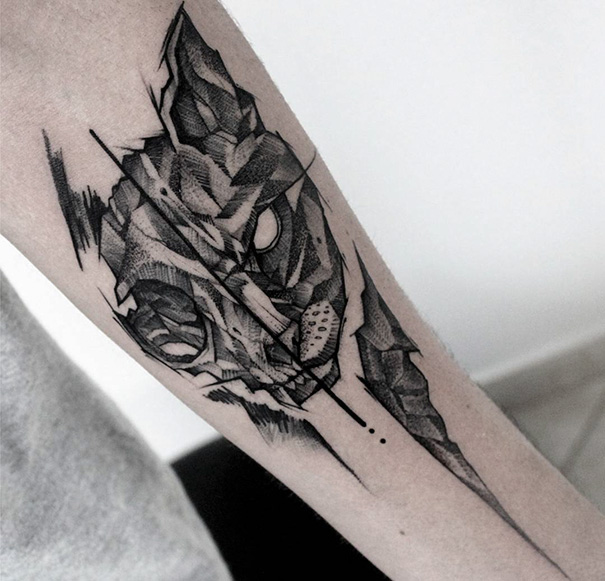 Geometrical cat skull arm tattoo