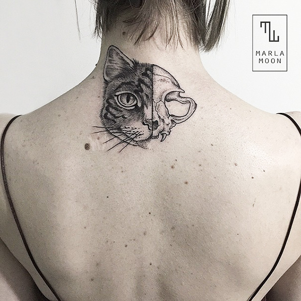 Cat and skull back neck tattoo
