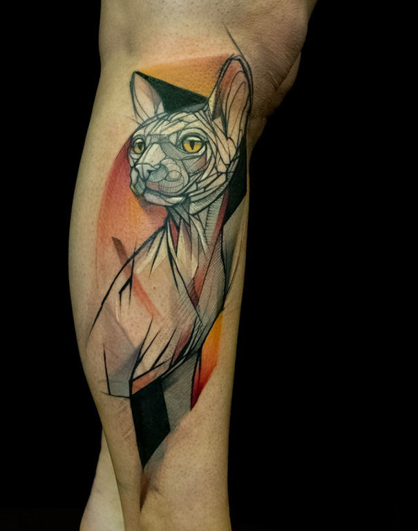 Colorful geometrical cat leg tattoo