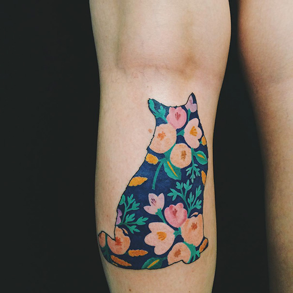 Cat and flowers back leg tattoo