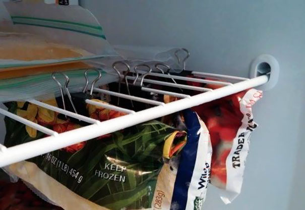 Use Binder Clips On Shelves To Maximize All Of The Unused Space In Your Fridge And Freezer