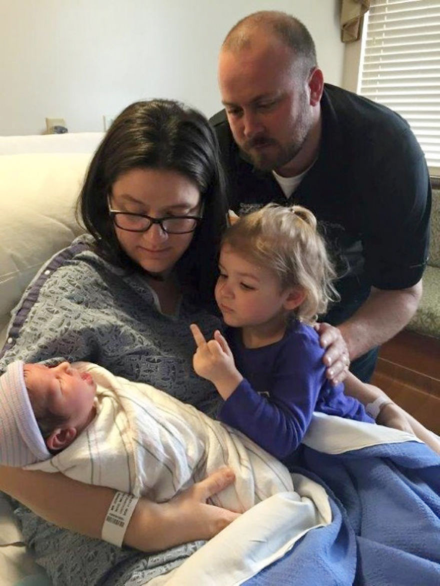 Sister welcomes newborn sibling to the family