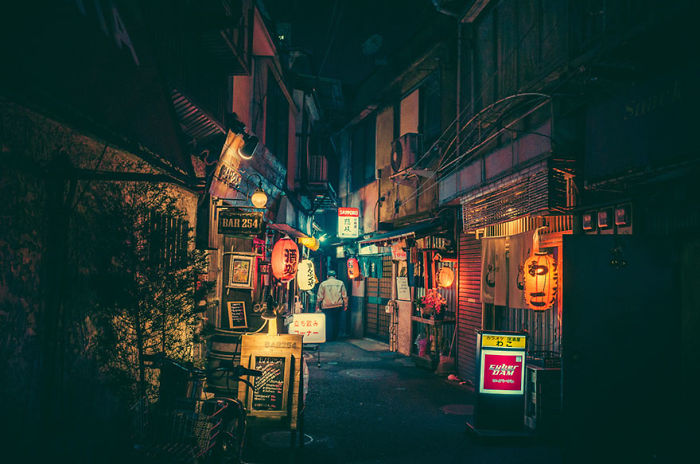 Night street scene in Japan with traditional lanterns and narrow alleys showcasing Japan street photography shots.