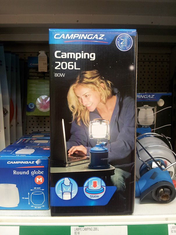 Box with camping light and picture of woman smiling and using computer