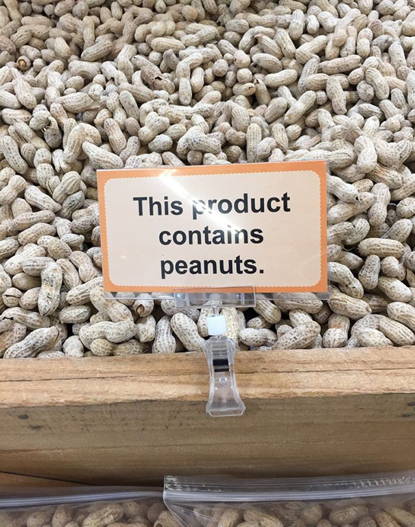 Peanuts and sign that says this product contains peanuts