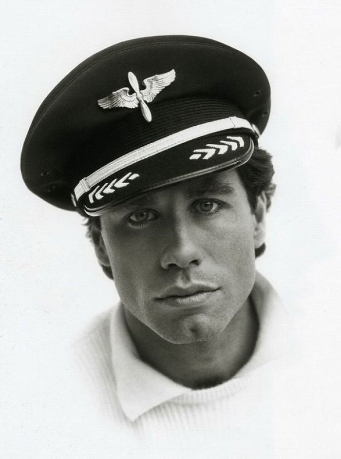 John Travolta Posing With His Pilot Hat, 1985. You Didn't Know He's A Certified Private Pilot, Did You?