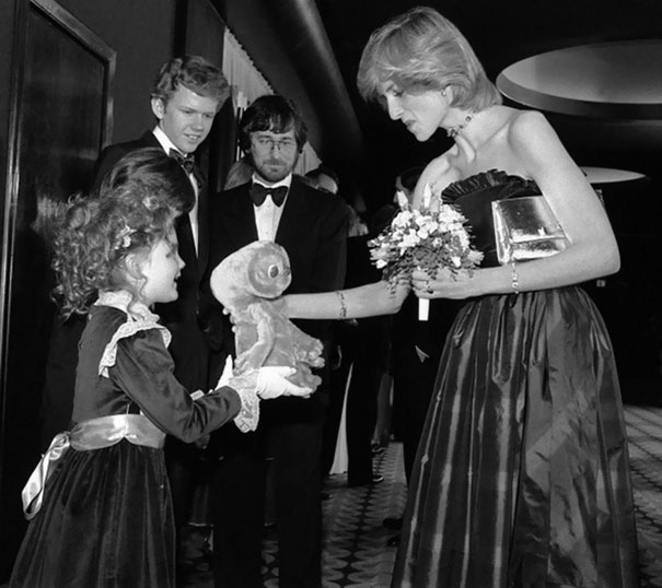 7-Year-Old Drew Barrymore Giving Princess Diana An E.T. Doll While Robert Macnaughton And Steven Spielberg Is Looking On At The London Premiere Of E.T.