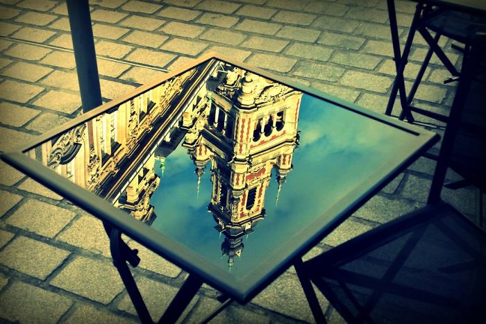 Reflection Of A Church On A Table