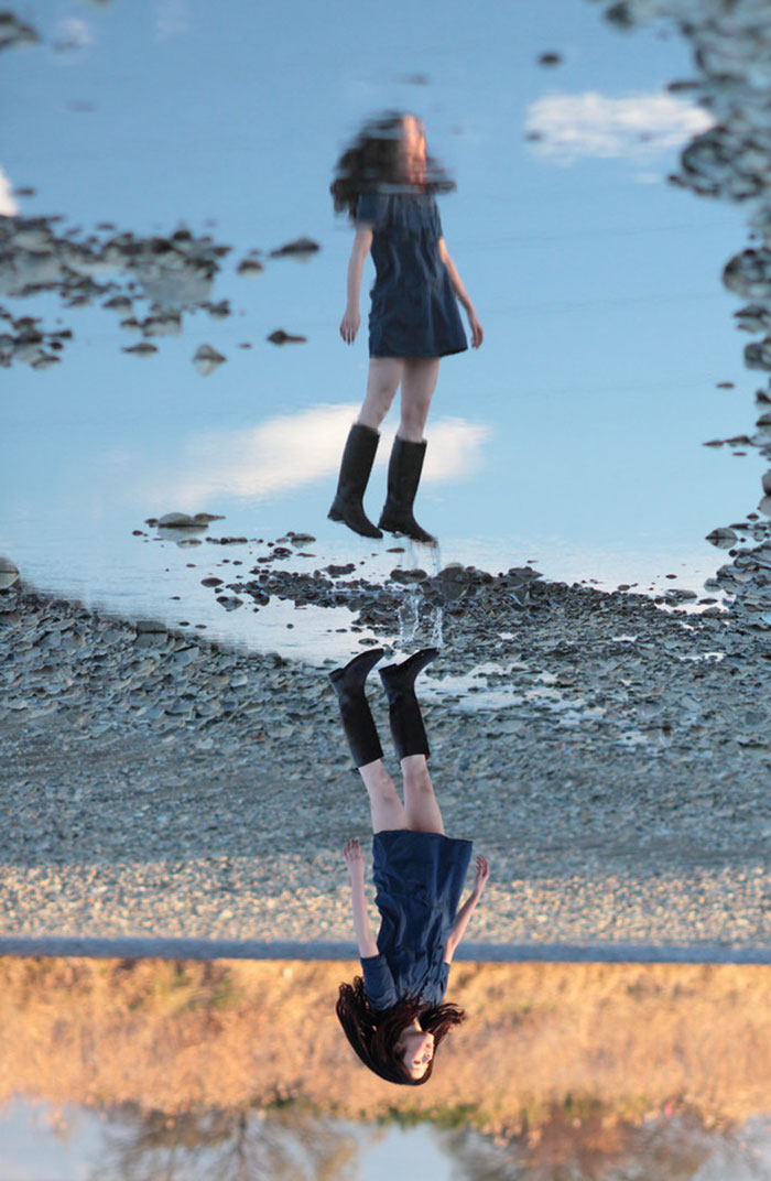 Reflection In A Puddle Makes My Friend Look Like She's Flying