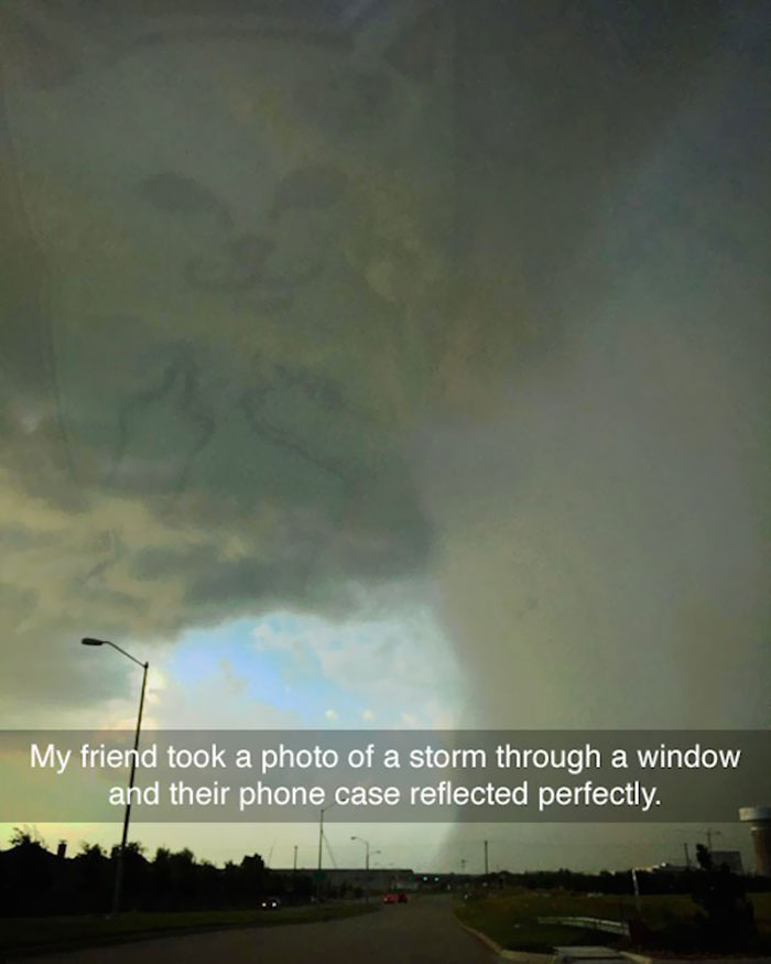 My Friend Took A Photo Of A Storm Through A Window And Their Phone Case Reflected Perfectly