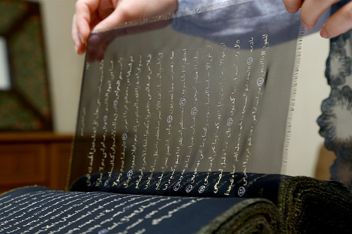 Artist Spends 3 Years Rewriting The Entire Quran In Gold On 164 Feet Of Silk By Hand