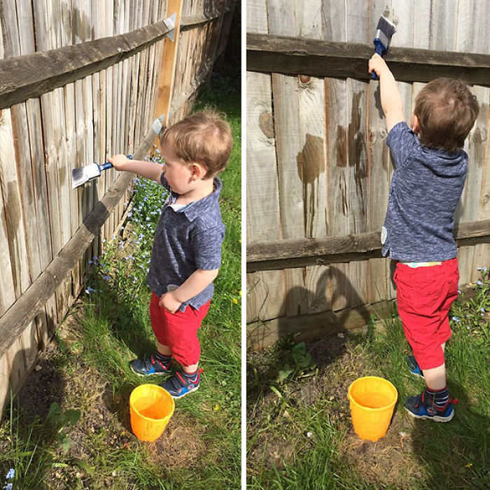 Ten al niño ocupado dejándole pintar la valla con agua