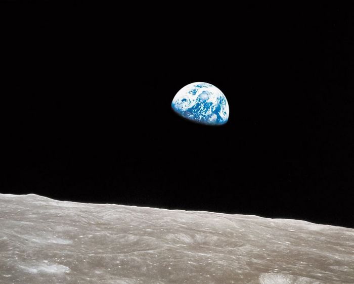 Famous photo of Earth rising over the lunar surface, capturing a historic moment from space exploration.
