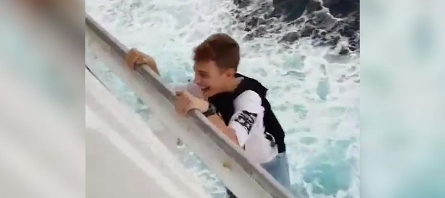 Daredevil Teenager Risks His Life By Hanging Off The Edge Of A Cruise Ship