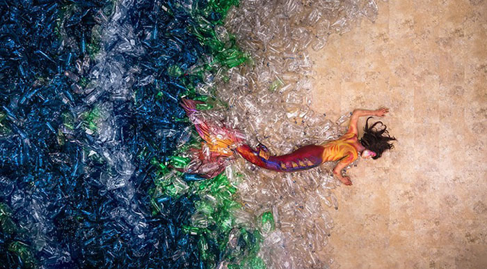 Mermaids Swim In A 10,000 Plastic Bottle Ocean To Show How Much Average Person Pollutes Earth