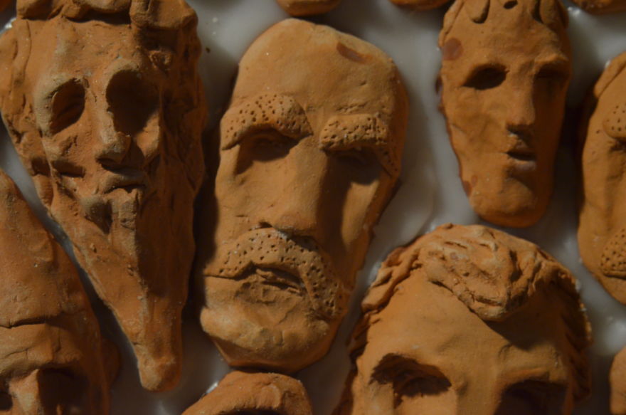 I Make Tiny Faces, Bodies, And Symbols Of Clay Dipped In Wax On Wooden Circles